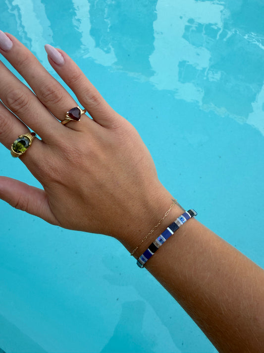 Handmade Spotted Eagle Ray bracelet featuring cobalt blue, navy, black, white, clear, and iridescent glass beads.