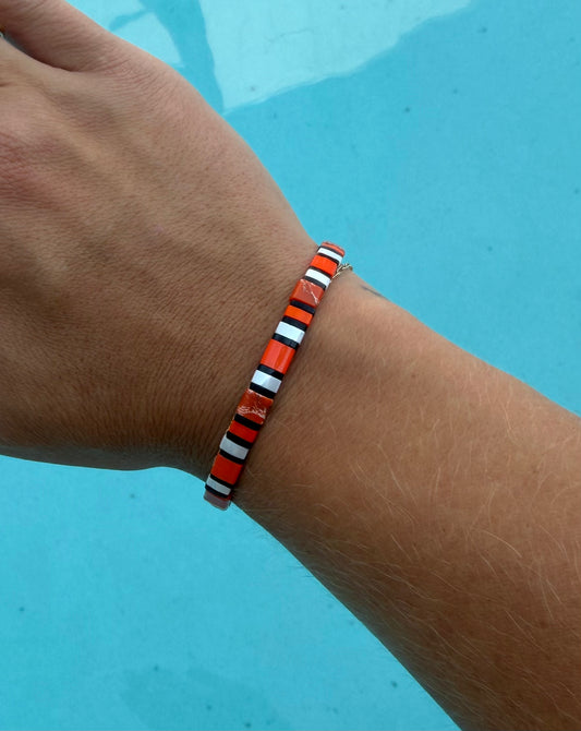 Close-up of the Clownfish bracelet’s orange, white, and black glass-bead pattern.