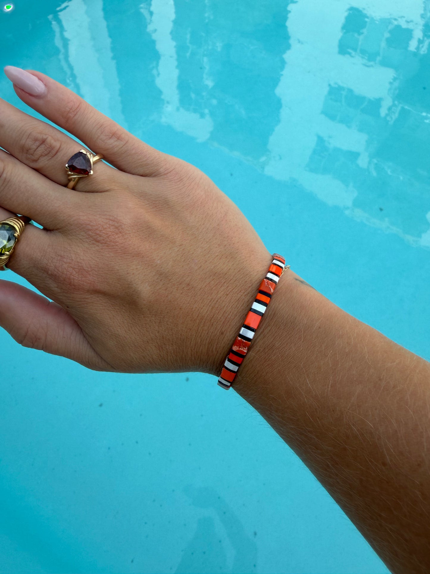 Handmade Clownfish bracelet featuring bright orange, white, and black glass beads.