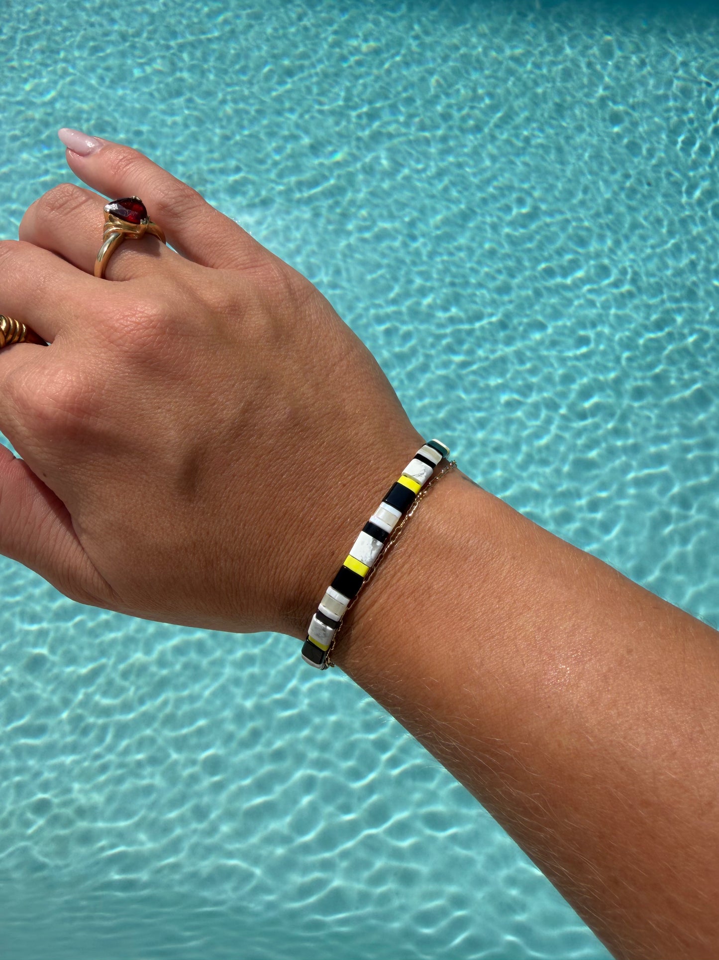 Handmade Moorish Idol bracelet featuring black, white, and bright yellow glass beads.