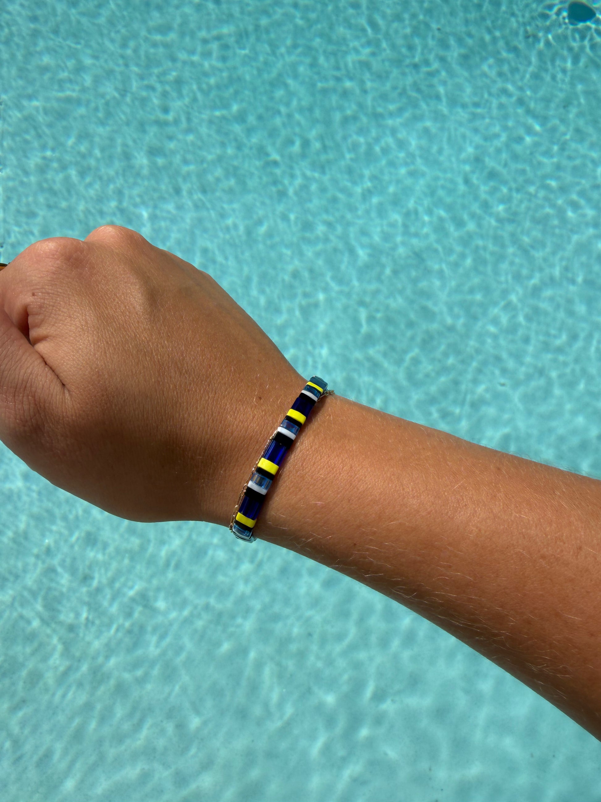 Handmade Regal Blue Tang bracelet featuring royal blue, black, and bright yellow glass beads.
