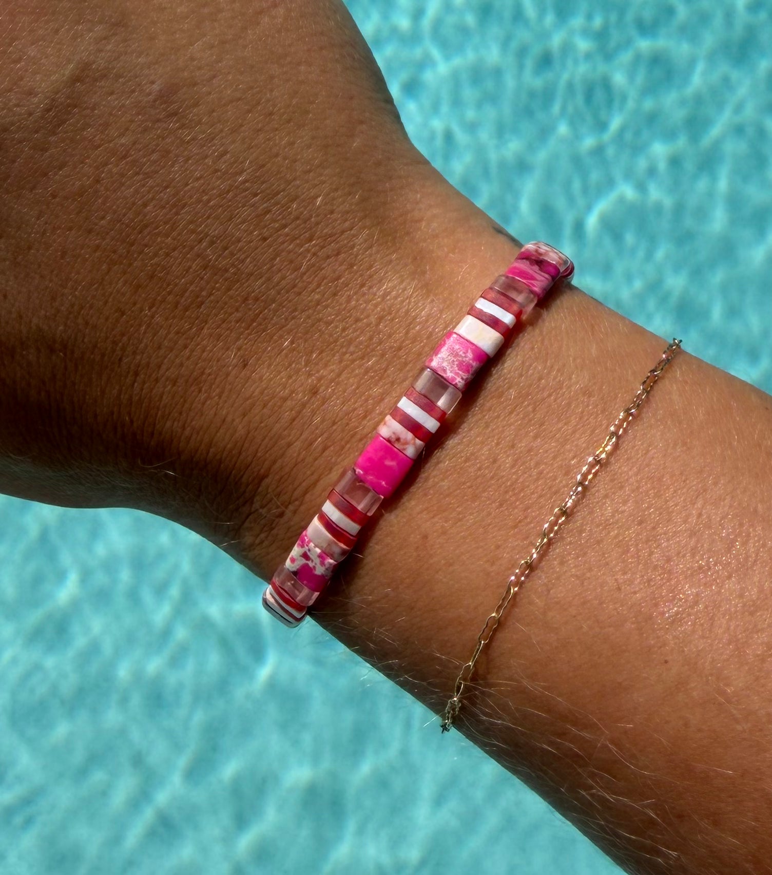 Close-up of the Pink Sea Star bracelet’s pink, white, berry, and translucent glass beads.